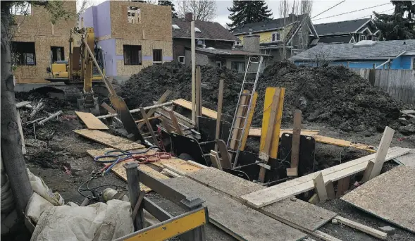  ?? JOHN LUCAS/ EDMONTON JOURNAL ?? A worker who has not been named by authoritie­s died Tuesday while working in a trench that collapsed at an infill project at 108th Avenue and 123rd Street.