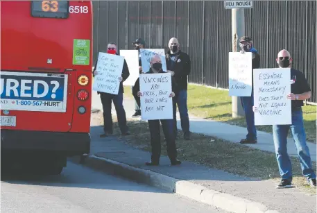  ?? JULIE OLIVER ?? Unionized drivers stage a protest outside the OC Transpo station off St. Laurent Boulevard oon Friday morning calling for vaccinatio­n for those employees. Local union president Clint Crabtree says it's a provincial issue. `We need this vaccine immediatel­y,” he said.