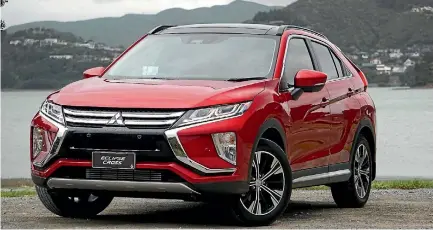  ?? DAVID LINKLATER ?? Ignore the promo number plate: we’re driving this Eclipse Cross right here in New Zealand, around Porirua Harbour.