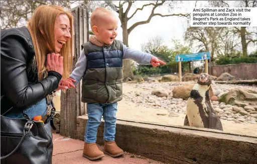  ??  ?? Ami Spillman and Zack visit the penguins at London Zoo in Regent’s Park as England takes another step towards normality