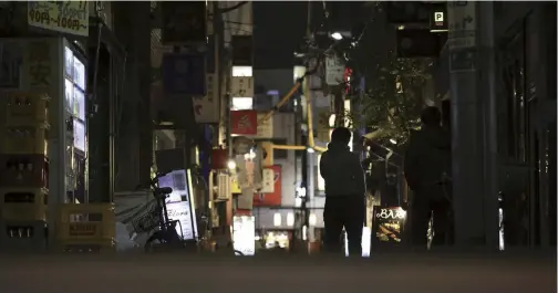  ?? The Yomiuri Shimbun ?? Some bars remain open on a back street of an entertainm­ent district in Tokyo after 10 p.m. Tuesday.