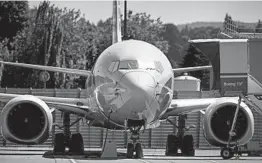  ?? LINDSEY WASSON/THE NEW YORK TIMES ?? A Boeing 737 Max is parked in storage at Boeing’s facilities in Renton, Washington.