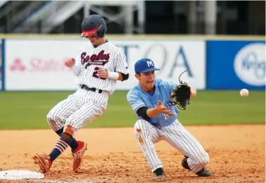  ?? STAFF PHOTOS BY DOUG STRICKLAND ?? Brentwood Academy’s Bryce Jarvis reaches third base as McCallie’s Dane Beard awaits the throw during the TSSAA Division II-AA state championsh­ip game Thursday afternoon at Middle Tennessee State University. McCallie, the losers-bracket winner, needed...