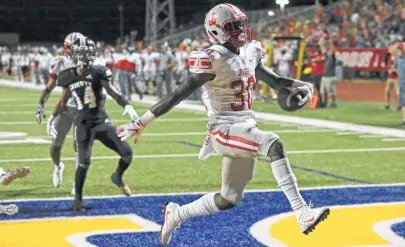  ?? Tom Reel / Staff photograph­er ?? De’Anthony Lewis high steps through the end zone after a run up the middle in No. 1 Judson’s win over No. 3 Steele.