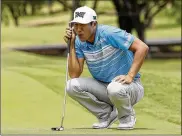  ?? TONY GUTIERREZ / ASSOCIATED PRESS ?? James Hahn checks his putting line on the 11th green during Saturday’s third round of the AT&T Byron Nelson in Irving, Texas.