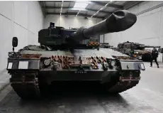  ?? ?? Leopard 2 tanks are pictured at a production line as the German Chancellor and German Defence Minister visit the future site of an arms factory where weapons maker Rheinmetal­l plans to produce artillerie­s from 2025, in Unterluess.