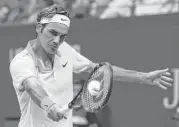  ?? Adam Hunger / Associated Press ?? Roger Federer was on the top of his game Wednesday in beating Richard Gasquet to reach the semifinals.