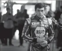  ?? JOHN RAOUX, THE ASSOCIATED PRESS ?? Elliott walks to an interview during NASCAR media day.