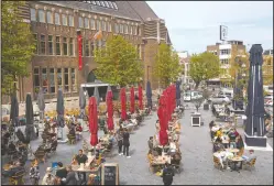  ?? (AP/Peter Dejong) ?? Guests line up to take their seats at spaced out terrace tables in Utrecht, Netherland­s.