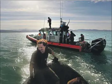  ?? Photograph­s by Carolyn Cole Los Angeles Times ?? MEMBERS of the Mexican navy, shown in the background in 2017, have been receptive to Sea Shepherd, a U.S. conservati­on group that sends boats to monitor gill-netting activities and help protect marine life.