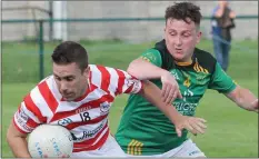  ??  ?? Tomás Hawkins (Ferns) is challenged by Brian Lacey (St. Fintan’s).