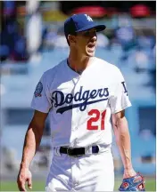  ?? HARRY HOW / GETTY IMAGES ?? Dodgers starting pitcher Walker Buehler went 62/3 innings Monday, allowing just one hit while walking three and striking out three in L.A.’s 5-2 win over the Rockies, which gave the Dodgers the NL West title.