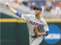 ?? NATI HARNIK/ASSOCIATED PRESS ?? Florida pitcher Jackson Kowar delivers against Texas during Tuesday’s College World Series eliminatio­n game in Omaha, Neb. Kowar struck out a career-high 13.