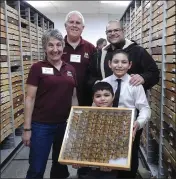  ?? COURTESY PHOTO, KATHY KEATLEY GARVEY ?? Vacaville City Councilman Mike Silva (back, right), a biotechnol­ogy professor at Solano Community College, and his sons Jovanni, 12, and Benjamin 6. recently admired the monarch display at the Bohart Museum of Entomology in Davis. With them are University of California, Davis professor Lynn Kimsey, museum director, and entomologi­st Jeff Smith, curator of the moth and butterfly collection.