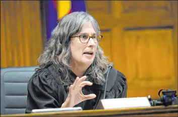  ?? Jack Dempsey The Associated Press ?? Judge Sarah Wallace presides over closing arguments Nov. 15 in a hearing in Denver for a lawsuit to keep former President Donald Trump off the Colorado ballot.