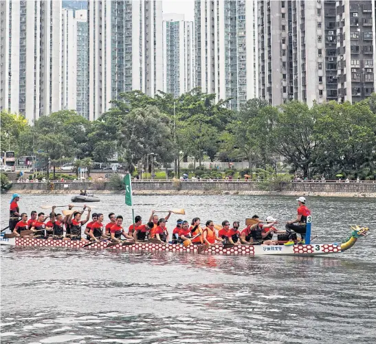  ??  ?? BEATING BACK THE DARK: The Darkness Fighters team heads to the starting line for a race in the annual Dragon Boat Festival in Hong Kong last month.