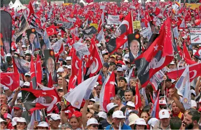  ?? AFP ?? Supporters of Muharrem Ince wave party flags during an election rally in Istanbul on Saturday. —