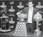  ?? By Julie Jacobson, AP ?? Nice haul: The Penguins’ Evgeni Malkin poses with the NHL’s Lindsay, Ross and Hart trophies.
