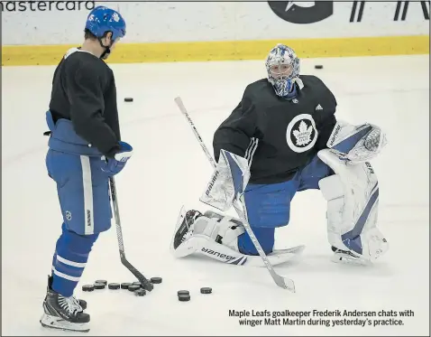  ?? JACK BOLAND/TORONTO SUN ?? Maple Leafs goalkeeper Frederik Andersen chats with winger Matt Martin during yesterday’s practice.