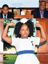  ??  ?? Jamaica Cultural Developmen­t Commission 2017 gold medallist and student at the Jessie Ripoll Primary School, Courtney Greaves, performs a cultural item at the Child Protection and Family Services Agency’s Education Transition­ing Forum held recently at the Jamaica Conference Centre in downtown Kingston. Seated at left is Minister of State in the Ministry of Education, Youth and Informatio­n Floyd Green.