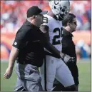  ?? Heidi Fang ?? Las Vegas Review-journal Raiders cornerback David Amerson leaves the field under the guidance of trainers against the Broncos on Oct. 1.