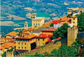  ?? ?? Sun-kissed: Ancient homes on the beautiful hillside of San Marino