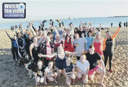  ??  ?? New Year’s Day dip at Roker Beach with Sunderland Royal Hospital staff and Fausto Bathing Club.