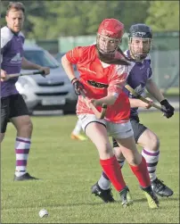  ?? Photograph: Donald Cameron. ?? Hannah Johnston wins the ball in front of Strathspey’s Martin Ross.