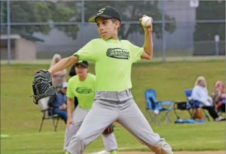  ?? STAN HUDY - SHUDY@DIGITALFIR­STMEDIA.COM ?? A Saratoga Springs Little League pitcher fires towards home Thursday night as Saratoga Springs Little League play wrapped up heading into Saturday’s Adirondack Cup battle against Glens Falls Little League.