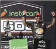  ?? Associated Press ?? VICTORY — Martin Truex Jr. celebrates in Victory Lane after winning a NASCAR Cup Series race at Phoenix Raceway, Sunday in Avondale, Ariz.
