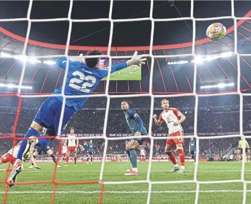  ?? ?? Joshua Kimmich’s header flies past Arsenal keeper David Raya in last night’s Champions League quarter-final second leg