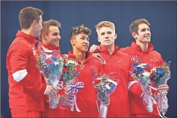  ?? Getty Images/tns - Carmen Mandato ?? From left, Trion High School graduate Brody Malone poses with teammates Sam Mikulak, Yul Moldauer, Shane Wiskus and Alec Yoder after being selected to the U.S. Olympic gymnastics team following June’s trials in St. Louis.