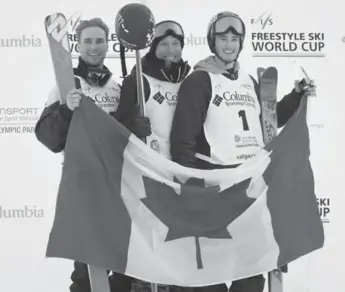  ?? JEFF MCINTOSH/THE CANADIAN PRESS ?? Justin Dorey, centre, celebrates his win alongside teammates Noah Bowman, right, and Matt Margetts on Friday.