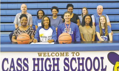  ??  ?? Recent Cass High School graduate Lyric Curtis (seated, second from left) signed her letter of intent on Thursday, May 31 to play basketball for Georgia Northweste­rn Technical College. Also on hand for the ceremony in the school’s gym was (from left)...
