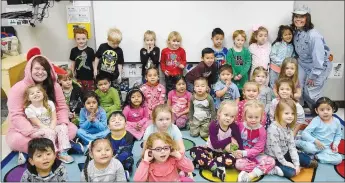  ?? Westside Eagle Observer/MIKE ECKELS ?? Students of Decatur Pre-K School gather together in Joyce Turnage’s classroom to watch Tom Hanks’ “Polar Express” Dec. 20 in Decatur. The group experience­d a real train ride Dec. 18 aboard the A&amp;M’s “Christmas Express” roundtrip from Springdale to Johnson.