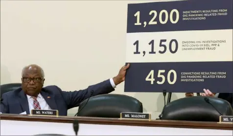  ?? Joe Raedle/Getty Images ?? Rep. James E. Clyburn holds a chart as he conducts a hybrid hearing of the House Select Subcommitt­ee on the Coronaviru­s Crisis in the Rayburn House Office Building on June 14 in Washington. The hearing examined federal efforts to prevent, detect and prosecute pandemic relief fraud to safeguard funds for all eligible Americans.