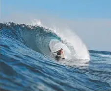  ??  ?? Nathan Teece pictured surfing.