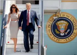  ?? AP ?? US President Donald Trump and first lady Melania Trump step off Air Force One as they arrive at London’s Stansted Airport, on Thursday. —