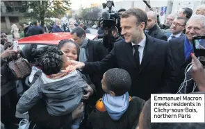  ??  ?? Emmanuel Macron meets residents in Clichy-sous-Bois, northern Paris