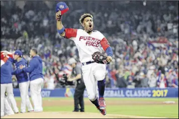  ?? GREGORY BULL / ASSOCIATED PRESS ?? Francisco Lindor celebrates Puerto Rico’s 6-5 win Friday over Team USA. The U.S. had to beat the Dominican Republic late Saturday to advance.