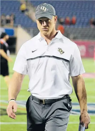  ?? JOE BURBANK/STAFF PHOTOGRAPH­ER ?? Coach Scott Frost and his UCF Knights have seen the early part of their season heavily disrupted by Hurricane Irma. The storm has forced the cancellati­ons of home games against Memphis and Georgia Tech.