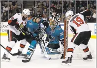  ?? PHOTO BY MARCIO JOSE SANCHEZ — ASSOCIATED PRESS ?? The Sharks’ Aaron Dell (30) stops a shot next to Justin Braun (61) and Senators Zack Smith, left, and Derick Brassard (19).
