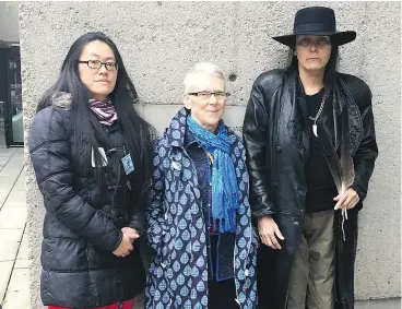  ?? — KEITH FRASER ?? Pipeline protesters Rita Tong, Mairy Beam and Kat Roivas wait outside B.C. Supreme Court on Tednesday to hear the fate of their applicatio­n that Justice Kenneth Affleck step aside from the proceeding­s.