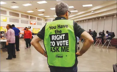  ?? SUN FILE (2016) ?? Poll workers and poll watchers will be on the lookout to be sure rules are adhered to at Clark County’s 172 polling sites during today’s primary election. Polls are open from 7 a.m. to 7 p.m.