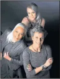  ?? LLOYD FOX/BALTIMORE SUN/TNS ?? Models Trena Taylor Brown, left, Rachel Alexandra Greiner, center, and Meg Hauge show off their gray style.