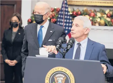  ?? ABACA PRESS ?? Anthony Fauci, right, joined by President Joe Biden and Vice President Kamala Harris, discusses the omicron variant on Monday.