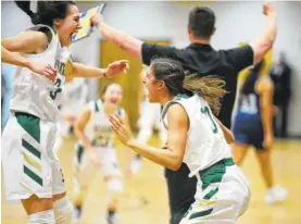  ?? STAFF PHOTOS BY ERIN O. SMITH ?? Silverdale’s Audrey Canter, left, and Bentlee Stiner celebrate their win over Knoxville Grace Christian on Tuesday at Silverdale Baptist Academy. The Lady Seahawks won 56-54.