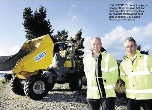  ?? Photograph: Kevin Emslie ?? NEW DEFENCES: Council projects manager Gavin Penman, left, and chief executive Jim Savege look over work to reinforce the flood bund at Ballater Golf Course.