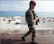  ?? (Photo Franck Fernandes) ?? Un militaire de l’opération Sentinelle sur la promenade des Anglais, le  juillet , treize jours après l’attentat.