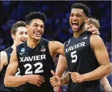  ?? ROB CARR / GETTY IMAGES ?? Kaiser Gates (left) and Trevon Bluiett celebrate Xavier’s 9166 victory over Florida State in the second round of the NCAA Tournament. Xavier plays Arizona tonight in the Sweet 16.